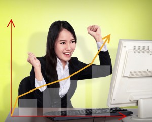 Business woman smile in front of her computer